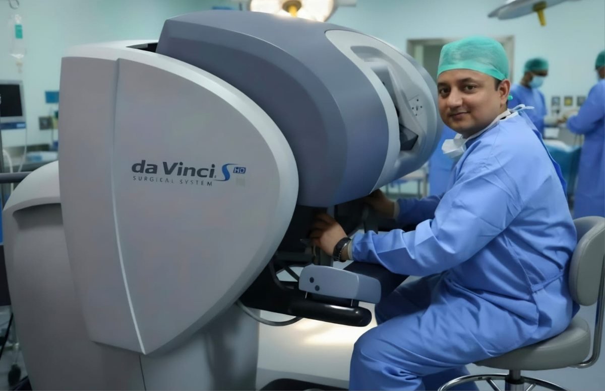 Dr. Sanjay Mazumder using a robotic-assisted surgical system
